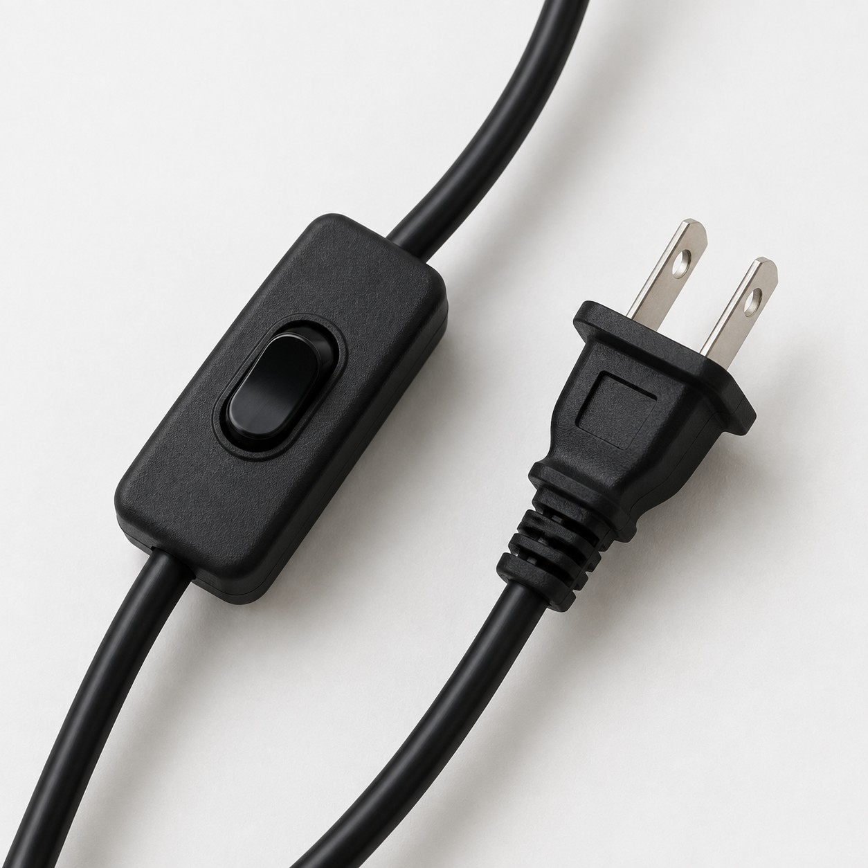 Black inline switch and US plug close-up