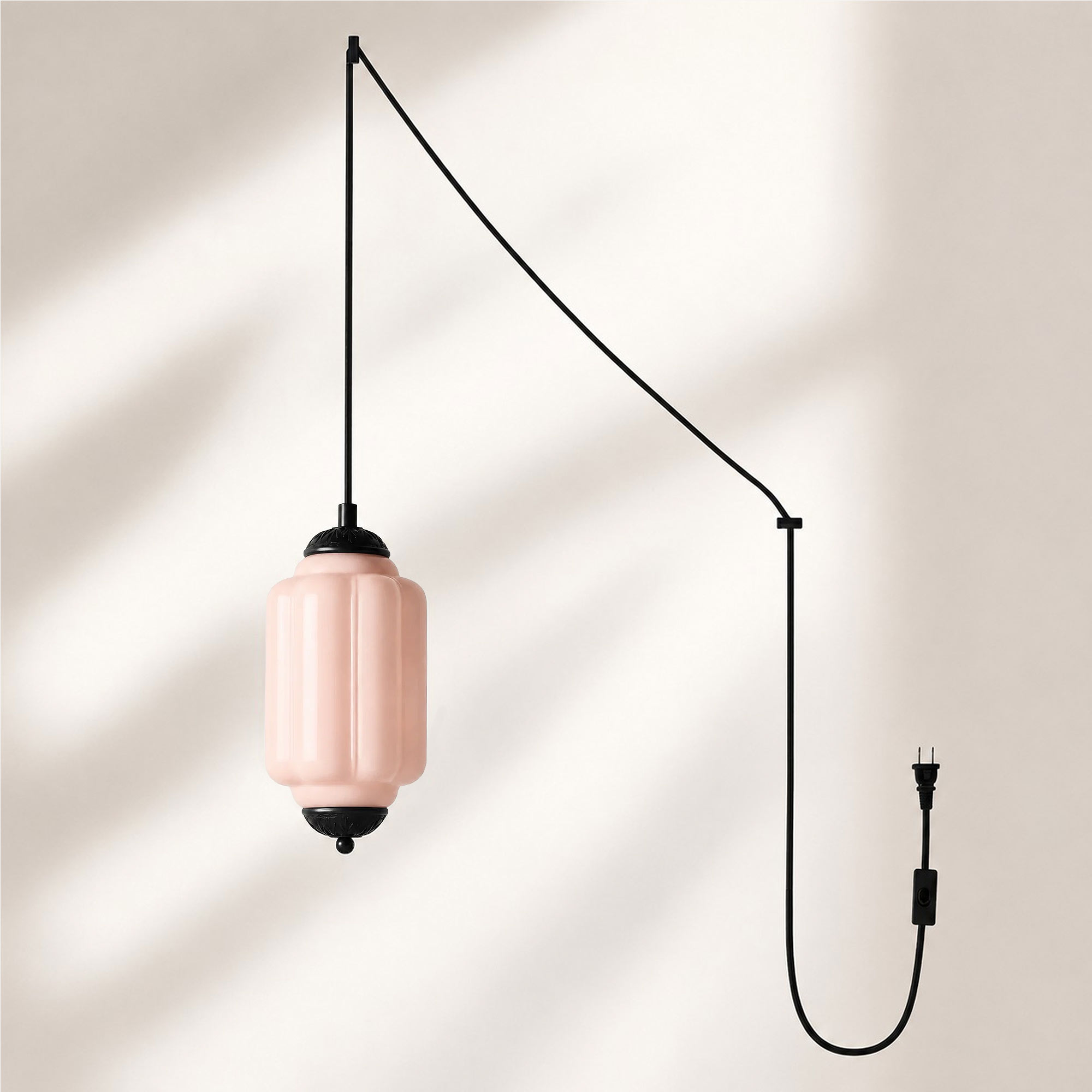 Black finish pendant with pink glass shade