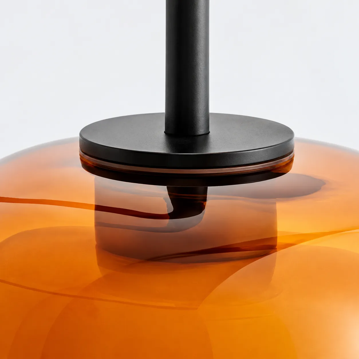 Close detail of the dark metal fitting and resin shade connection