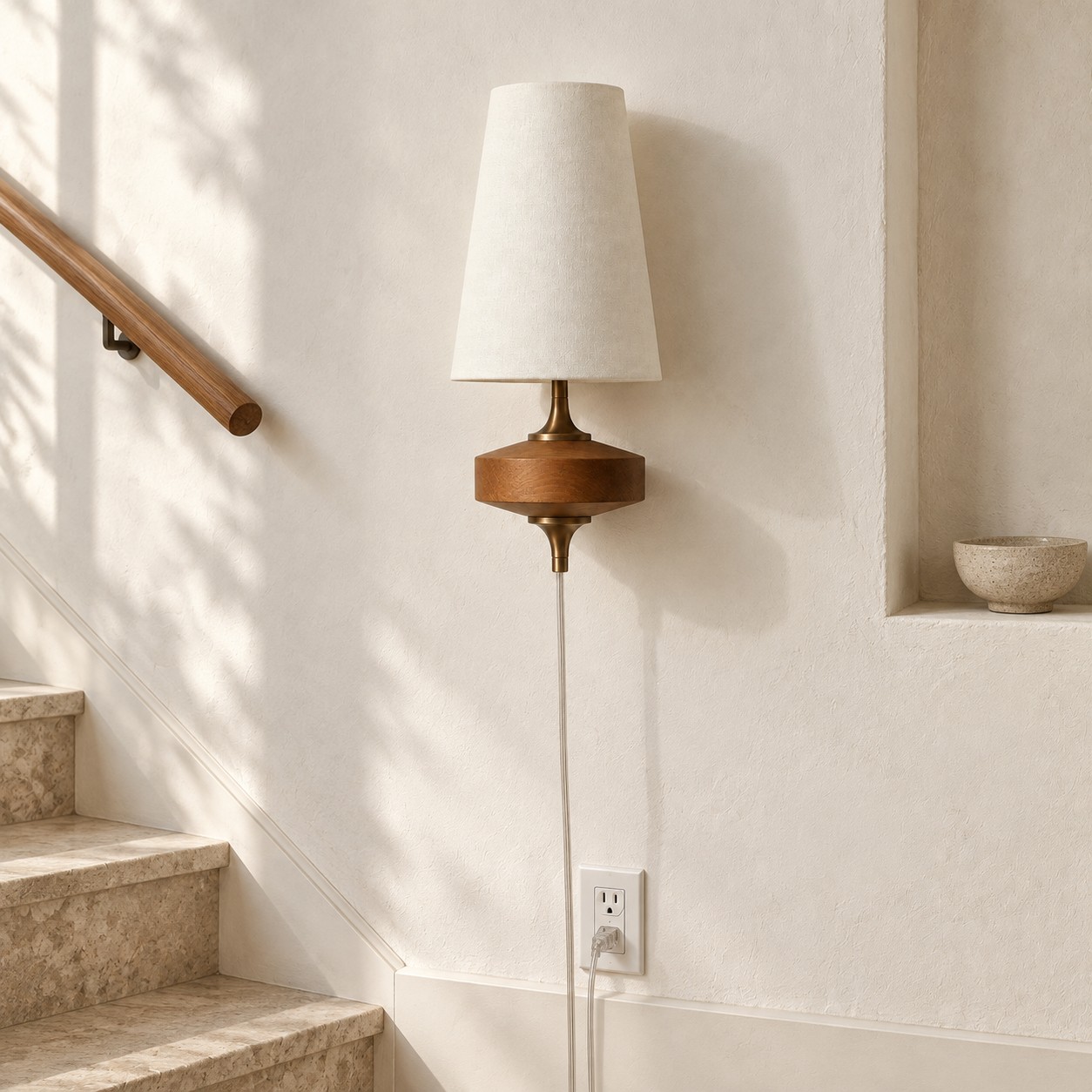 Ivory Hour Rho plug-in wall sconce switched off on a stair landing