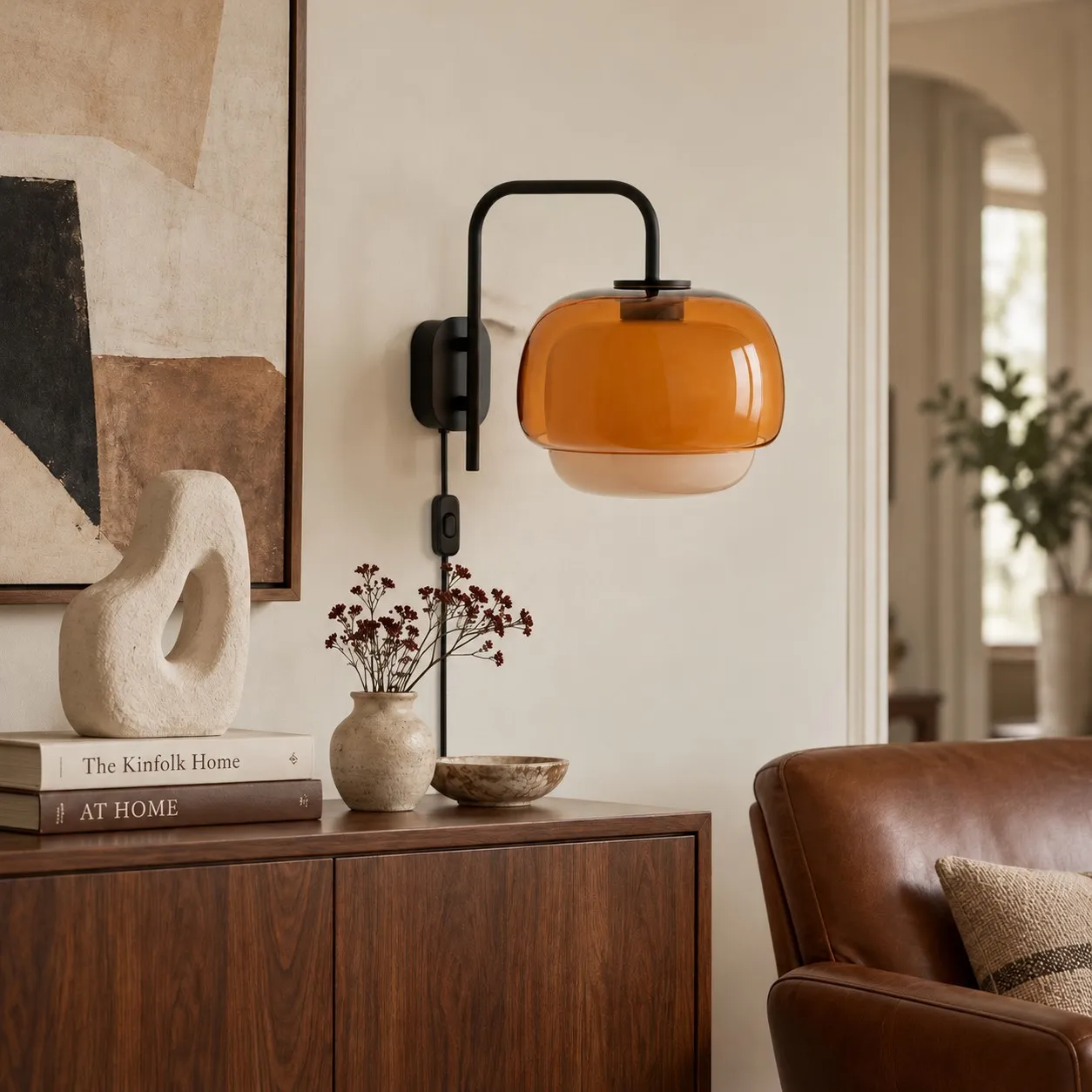 Orange resin wall lamp above a living room sideboard