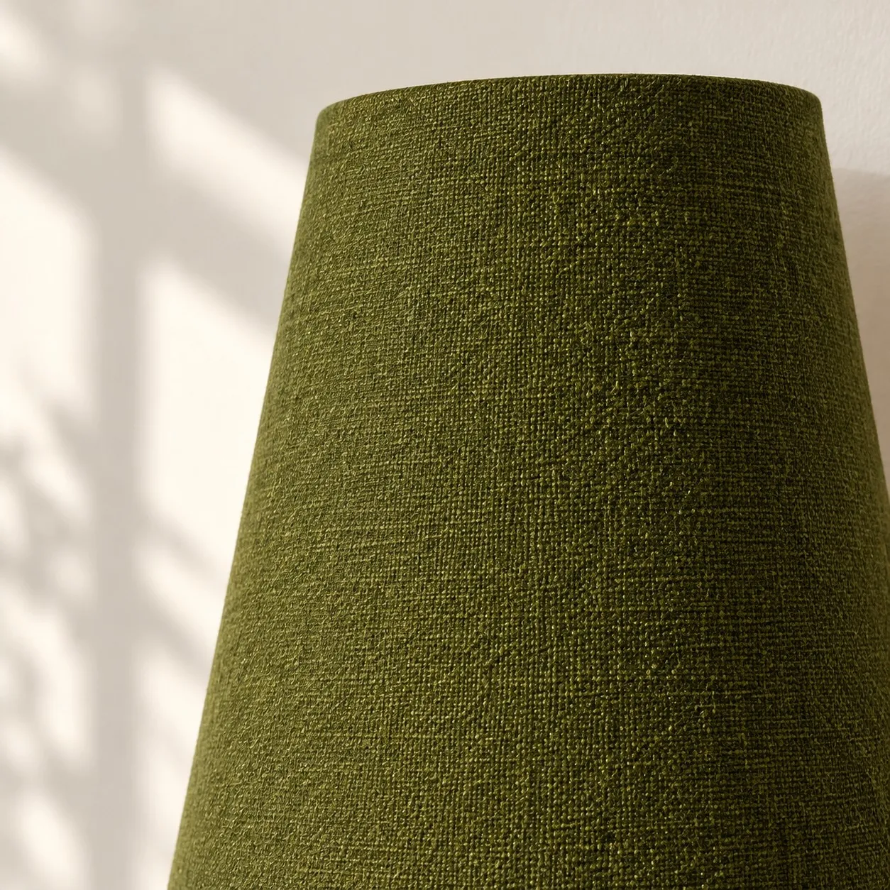 Close view of the green woven shade, wide at the top