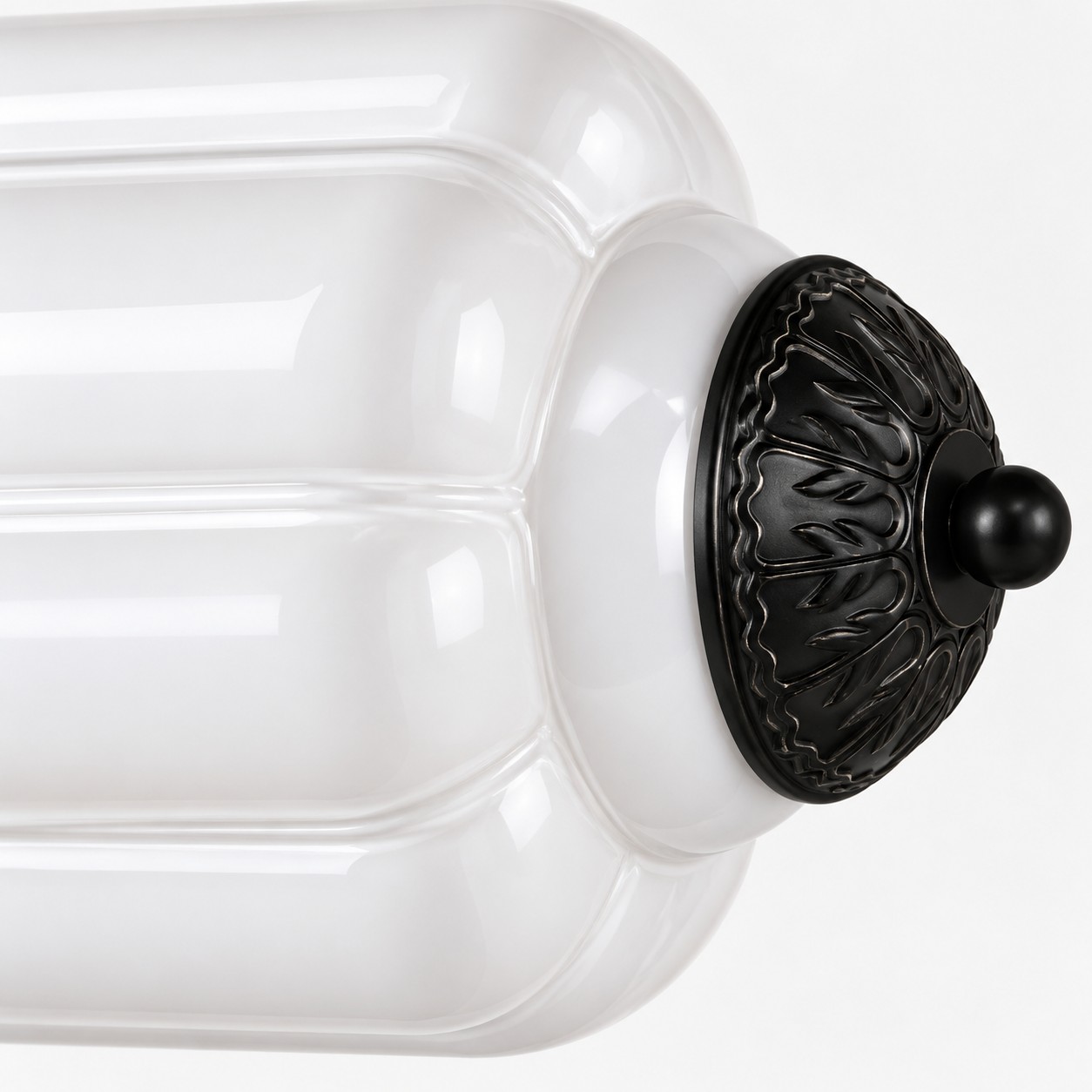 Turned metal cap closing the fluted glass shade