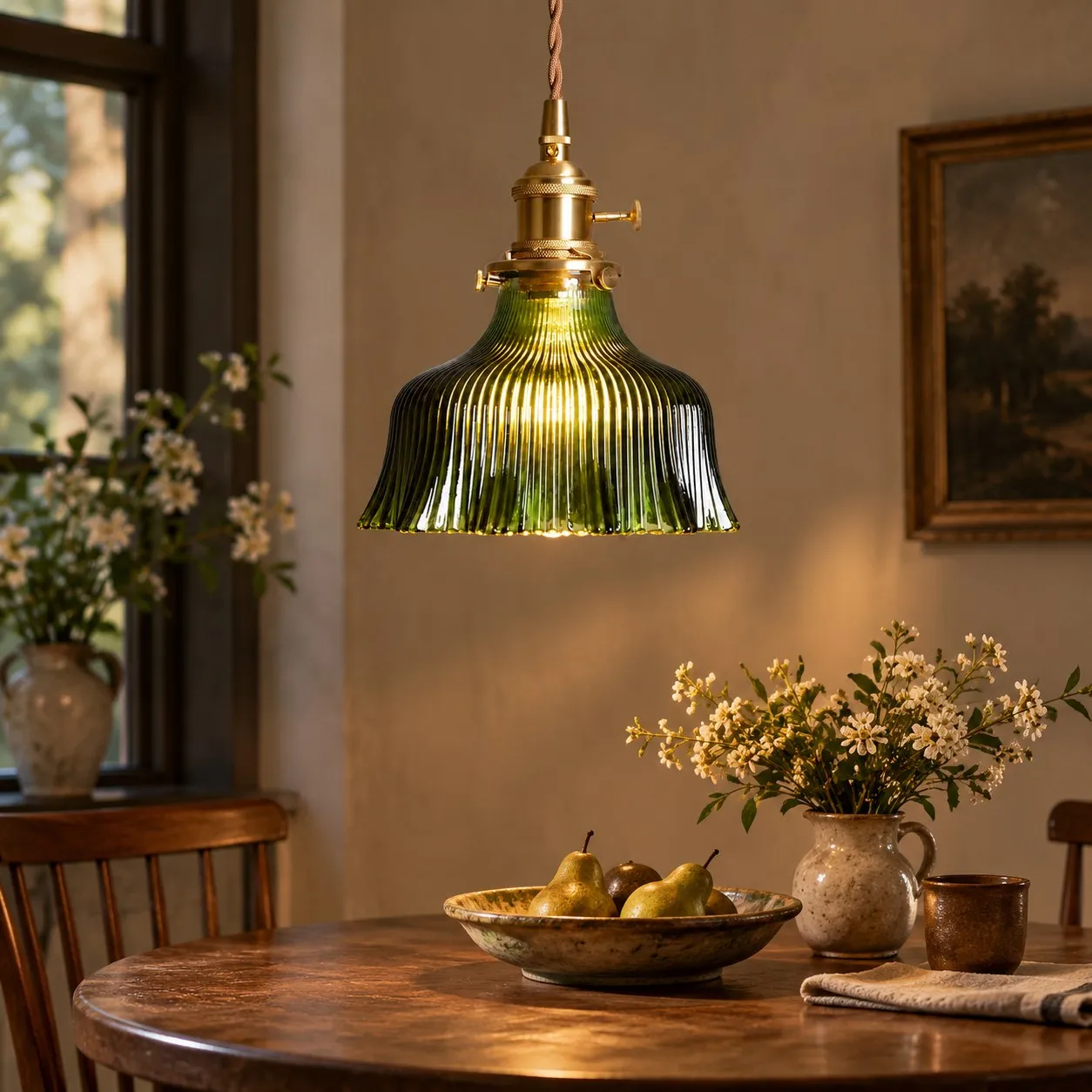 Vintage green glass pendant light over a dining table