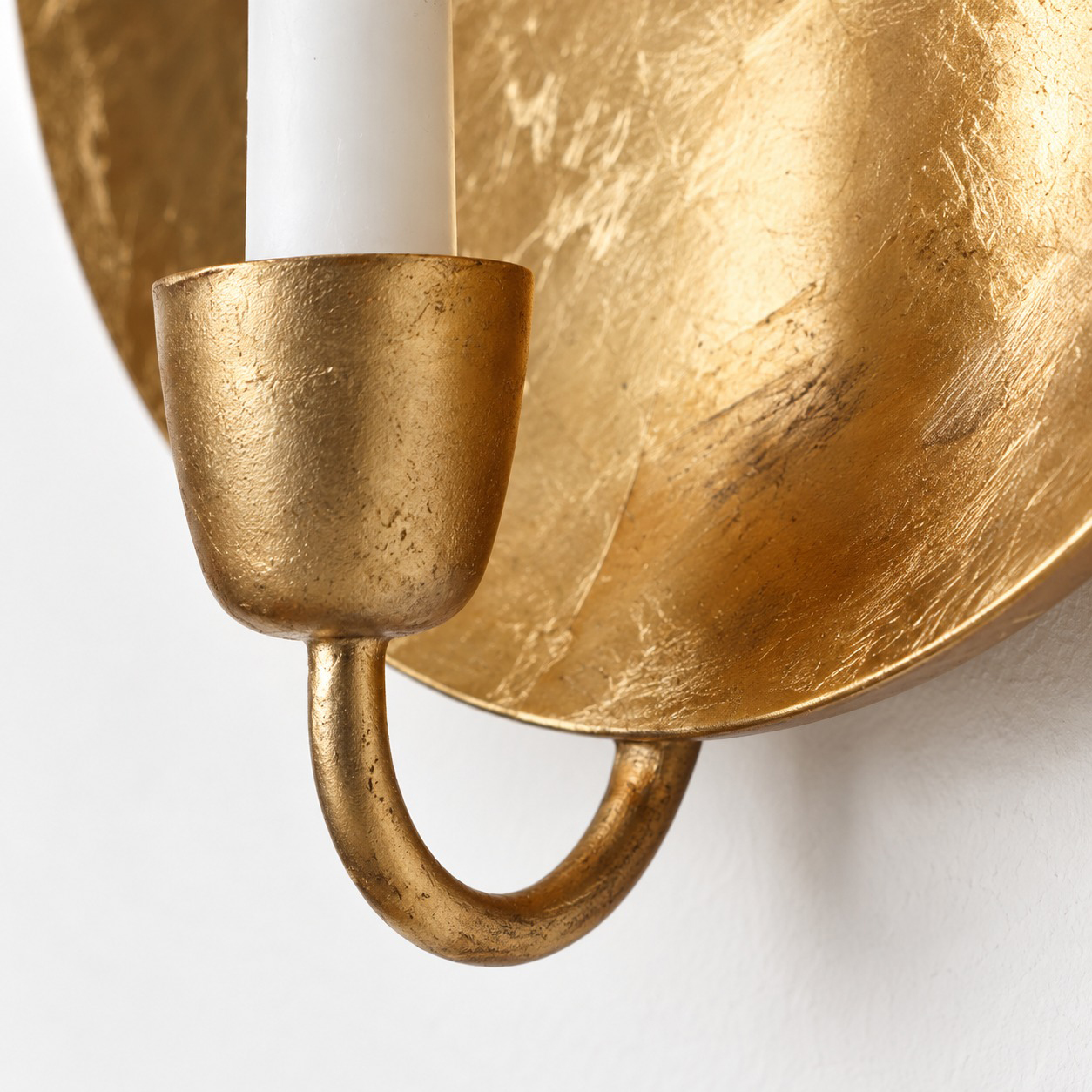 Gold candle cup and curved support; original product photograph