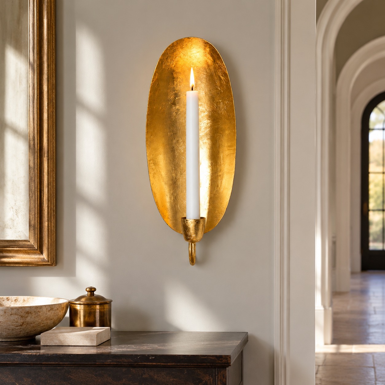 The entrance hall with gold leaf wall candle holder; illustrative interior