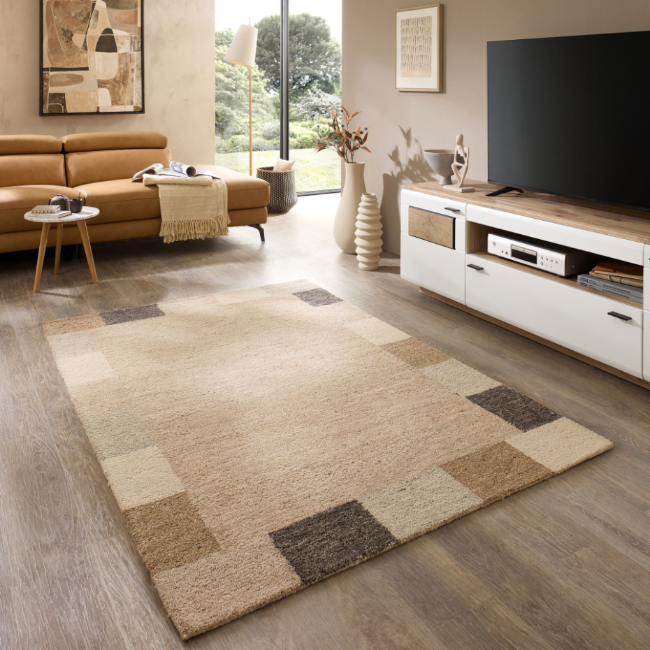 Tapis en laine tufté main aux couleurs douces et bordures