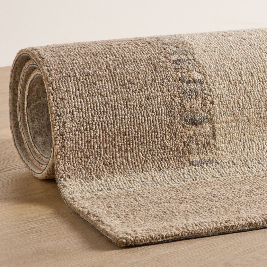 Tapis en laine tufté main aux couleurs douces et bordures
