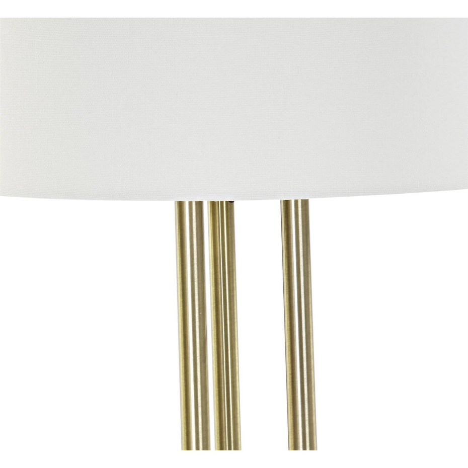 Lampadaire en métal doré et abat-jour en lin