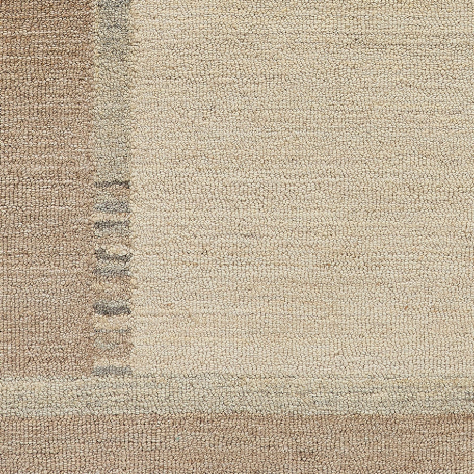 Tapis en laine tufté main aux couleurs douces et bordures