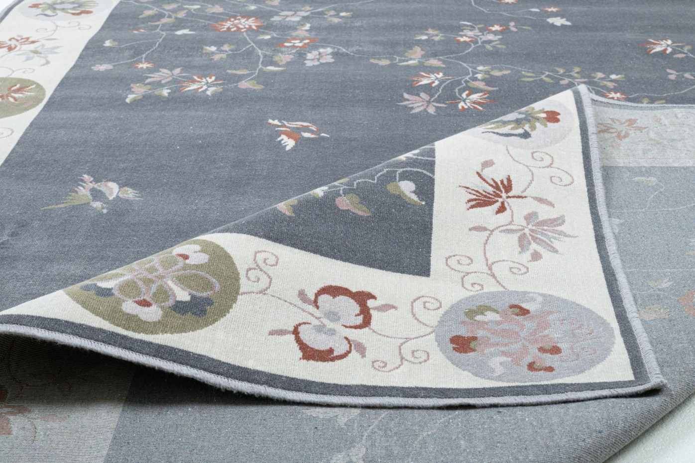 Tapis tissé avec bordure et motif floral avec effet brillant - Cherina