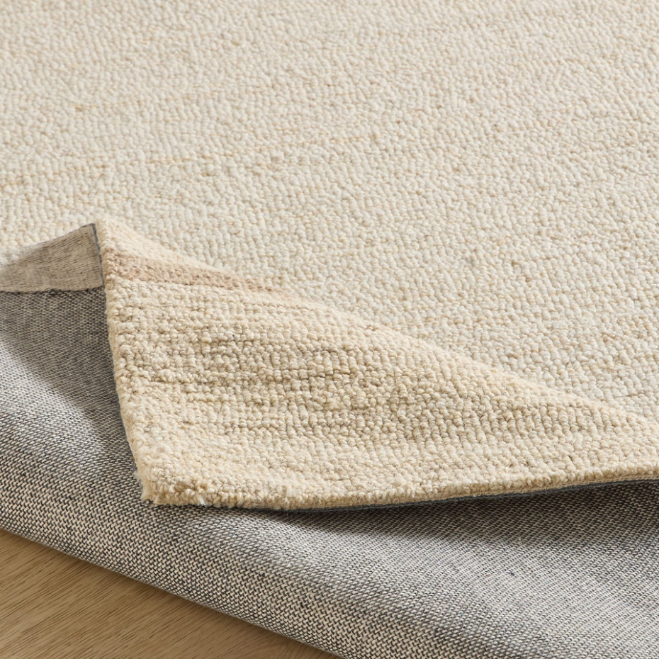Tapis en laine tufté main aux couleurs douces et bordures