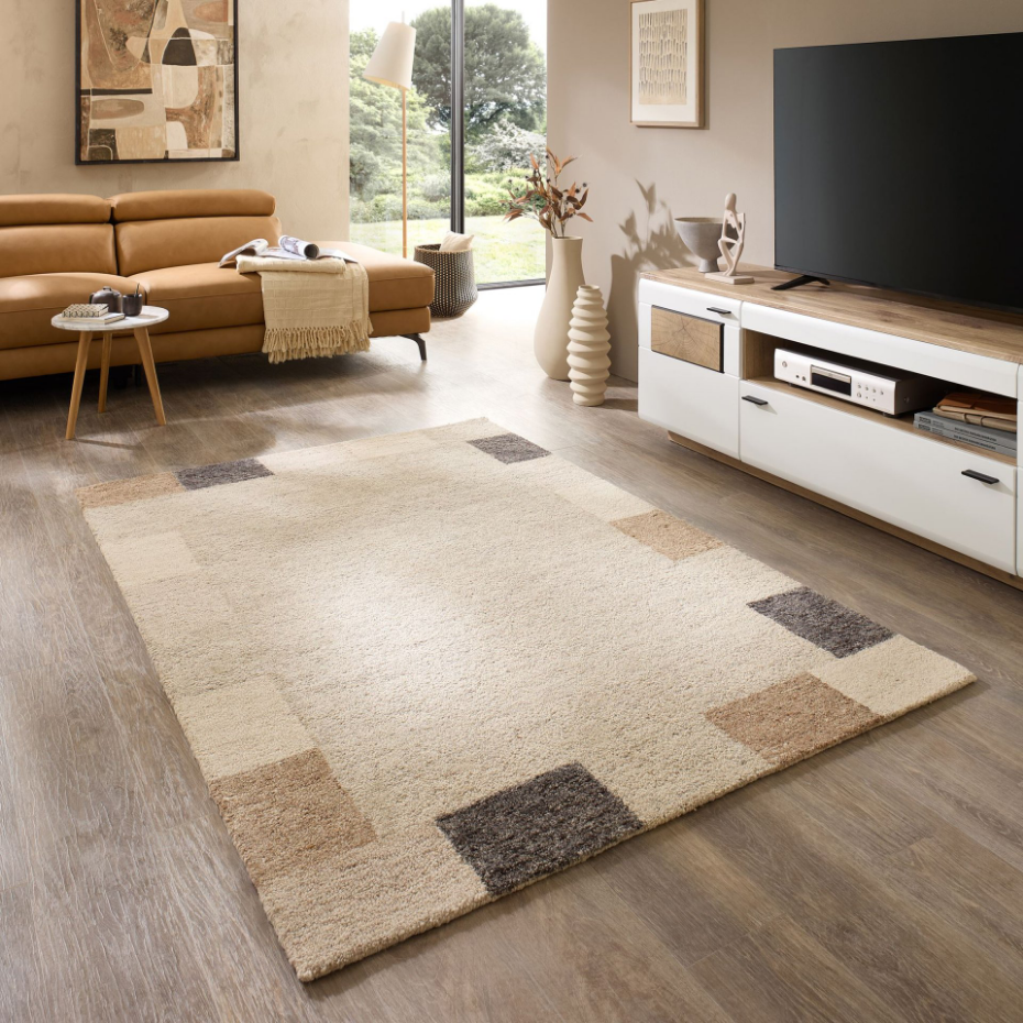 Tapis en laine tufté main aux couleurs douces et bordures