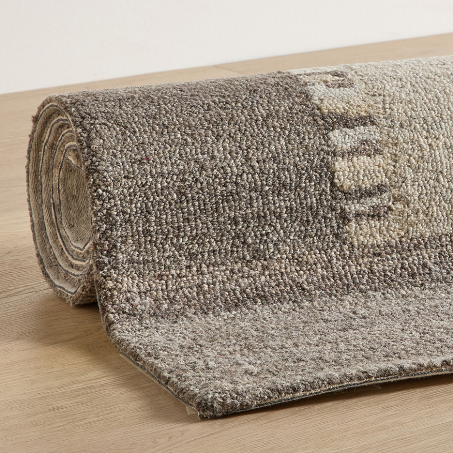 Tapis en laine tufté main aux couleurs douces et bordures