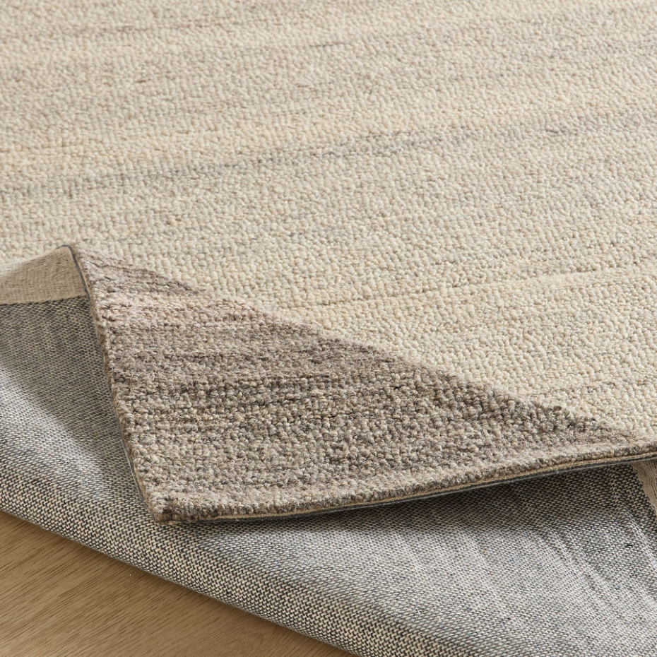 Tapis en laine tufté main aux couleurs douces et bordures
