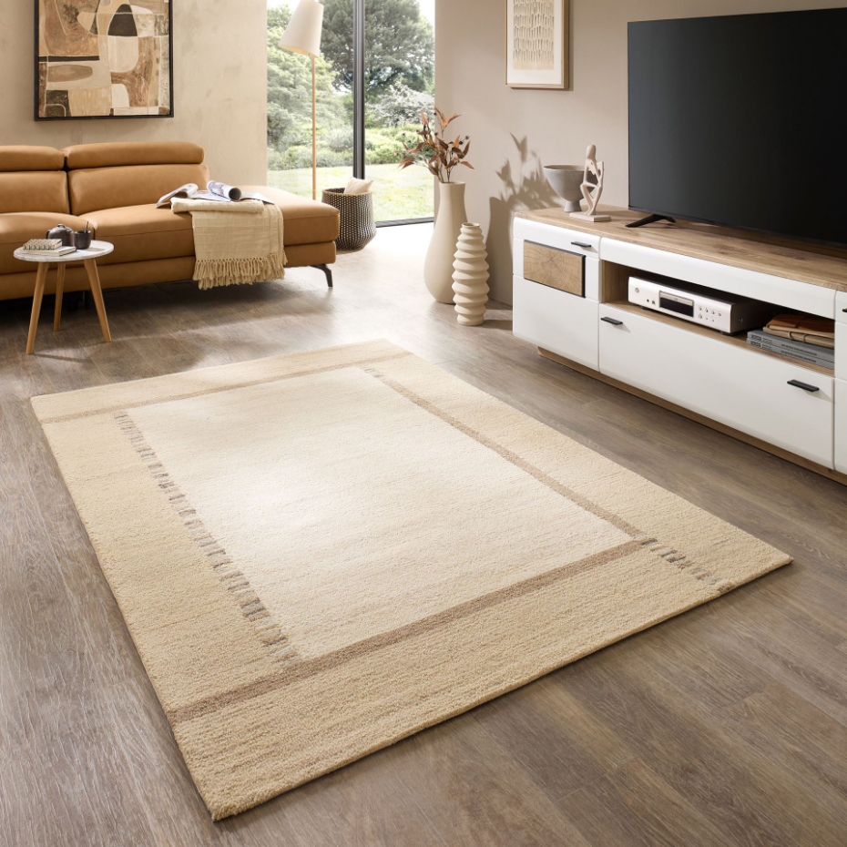 Tapis en laine tufté main aux couleurs douces et bordures