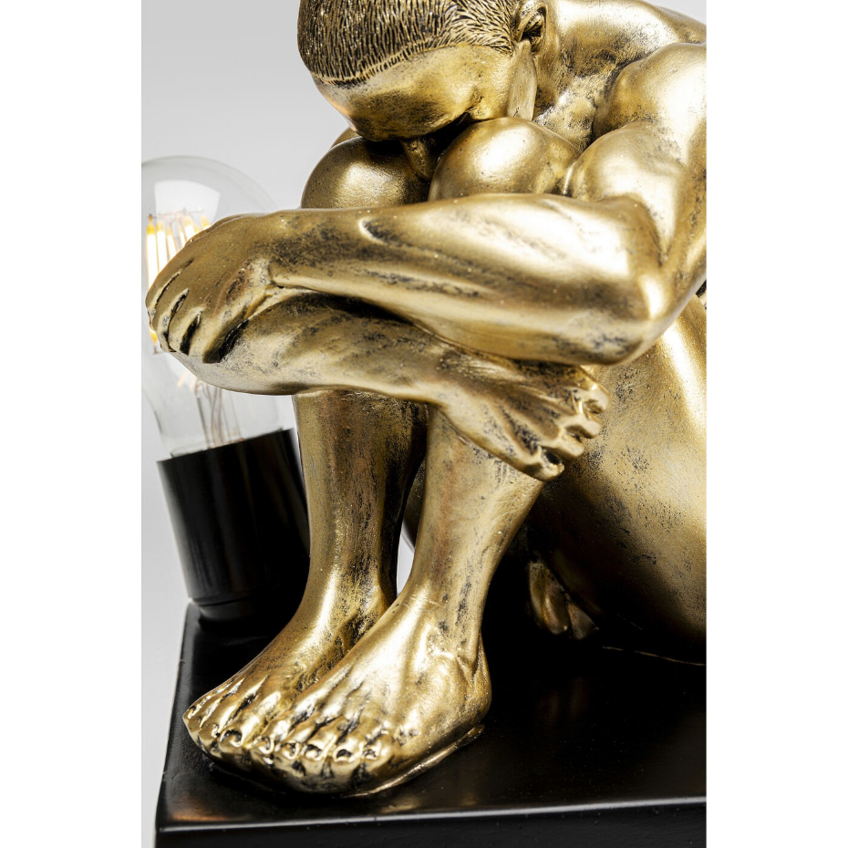 Lampe homme recroquevillé