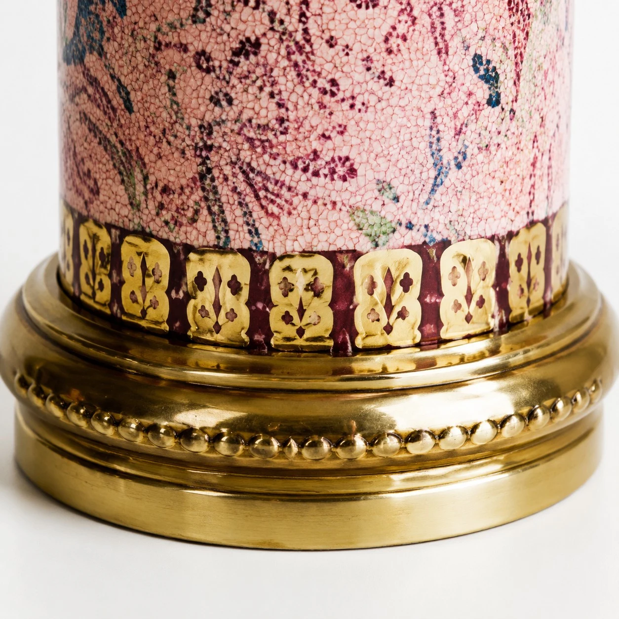 Antique brass-tone trim and ceramic base detail