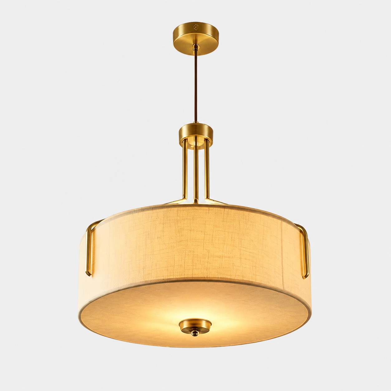 Fabric drum LED pendant light with a brass-tone metal frame